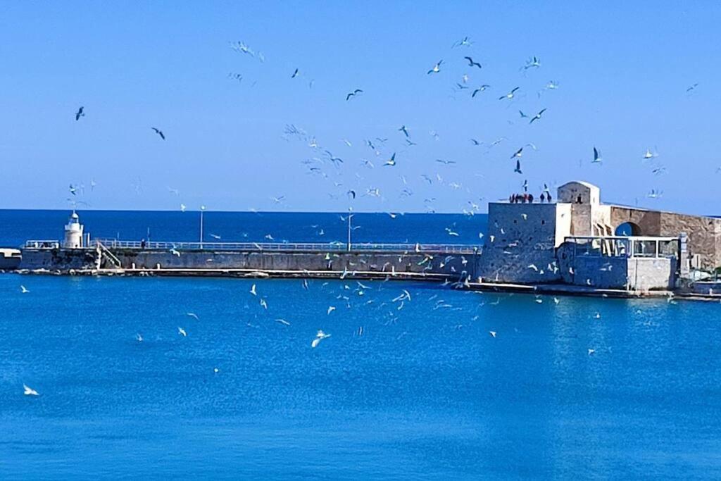 شقة Emozioni Dal Porto تراني المظهر الخارجي الصورة